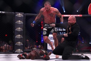 Schilling (standing) looks over an unconscious Melvin Manhoef (Dave Mandel/Sherdog)