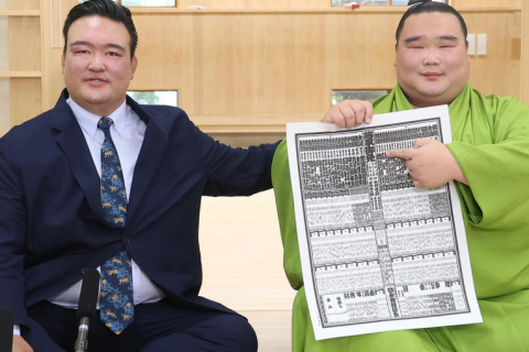 Sumo wrestler Shirokuma with the 2024 aki banzuke, showing himself debuting in the makuuchi (top division).