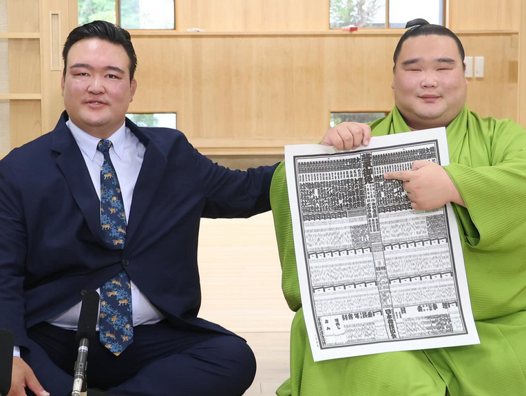 Sumo wrestler Shirokuma with the 2024 aki banzuke, showing himself debuting in the makuuchi (top division).