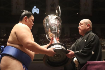 Sumo wrestler Onosato receives the Emperor's Cup after winning the 2024 aki basho in Tokyo, Japan.