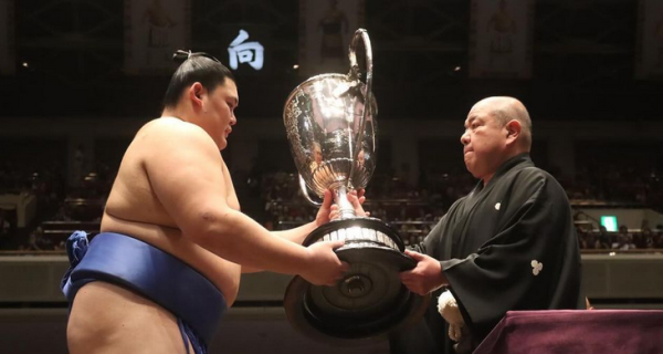 Sumo wrestler Onosato receives the Emperor's Cup after winning the 2024 aki basho in Tokyo, Japan.