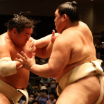 Sumo wrestlers Hoshoryu (left) and Onosato clash during an all stables practise in May 2025.