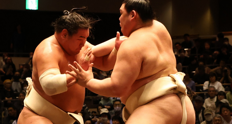 Sumo wrestlers Hoshoryu (left) and Onosato clash during an all stables practise in May 2025.