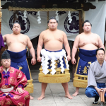 Sumo yokozuna Hoshoryu (center) flanked by Hiradoumi (left) and Meisei (right) before the 2025 May tournament.