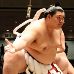 Yokozuna Onosato performing the dohyo iri at a sumo event in 2025.