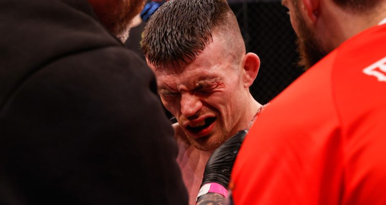 Harry Hardwick winces after a clash of heads with Javier Garcia in the main event of Cage Warriors 186.