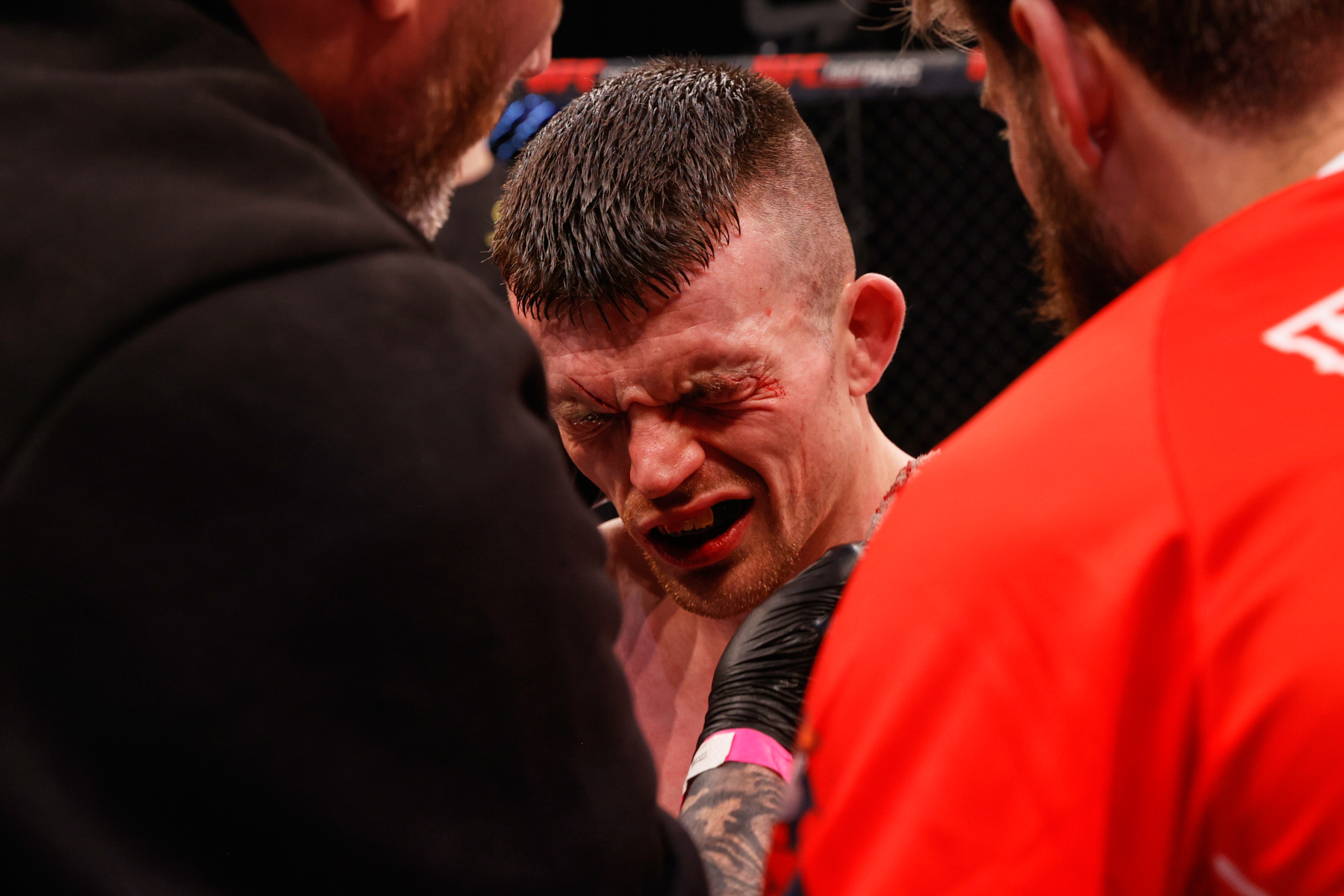 Harry Hardwick winces after a clash of heads with Javier Garcia in the main event of Cage Warriors 186.