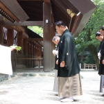 Sumo yokozunas Hoshoryu and Onosato and ozeki Kotozakura performing a ritual at the Atsuta shrine in Nagoya.