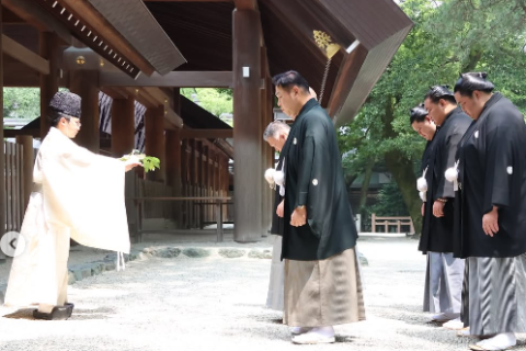 Sumo yokozunas Hoshoryu and Onosato and ozeki Kotozakura performing a ritual at the Atsuta shrine in Nagoya.