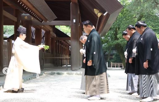 Sumo yokozunas Hoshoryu and Onosato and ozeki Kotozakura performing a ritual at the Atsuta shrine in Nagoya.
